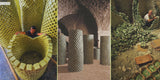 Artisans stacking and aging laurel soap into tall, ventilated towers inside traditional stone-walled drying rooms.